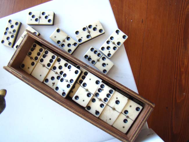 A boxed set of 28 bone and ebony dominoes from the Civil War period circa 1865